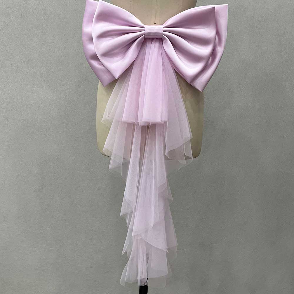 Elegant satin wedding bow for bridal dress with layered tulle cascading down for a romantic touch