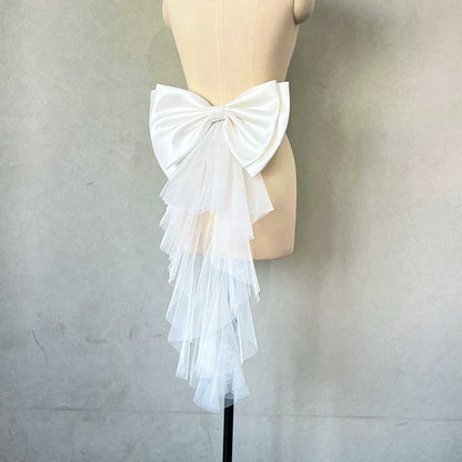 Elegant satin wedding bow for bridal dress featuring sheer layered tulle detail on a mannequin