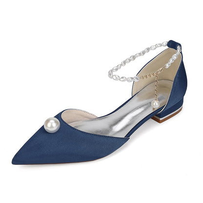 Elegant navy satin wedding flats with pearls for a stylish bridal look