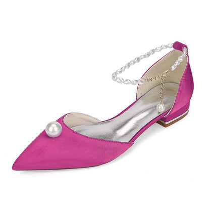 Pink satin wedding flats with pearls featuring a pointed toe and elegant ankle strap