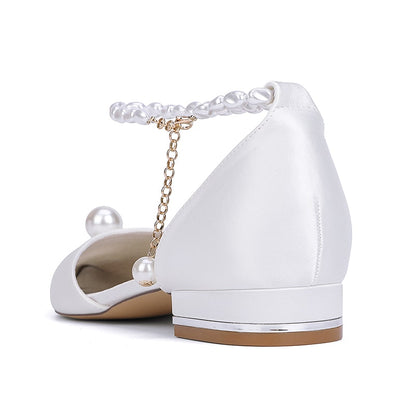 Elegant satin wedding flats with pearls featuring a stylish ankle strap and chic design