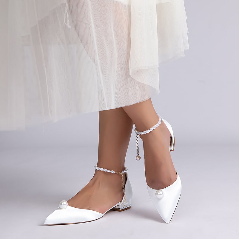 Elegant satin wedding flats with pearls, featuring a stylish ankle strap and pointed toe design
