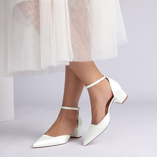 Elegant white satin wedding shoes for bride with ankle strap and chic pointed toe design