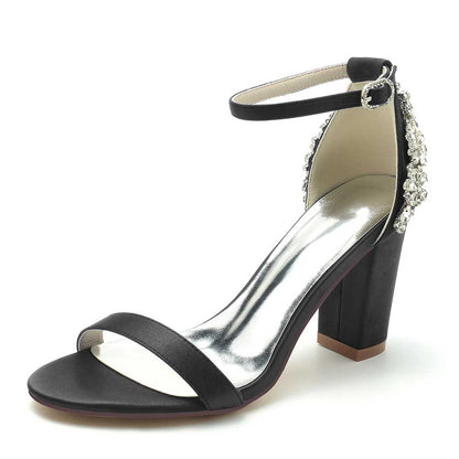 Elegant black wedding sandals for brides with ankle strap featuring a stylish block heel and decorative embellishments