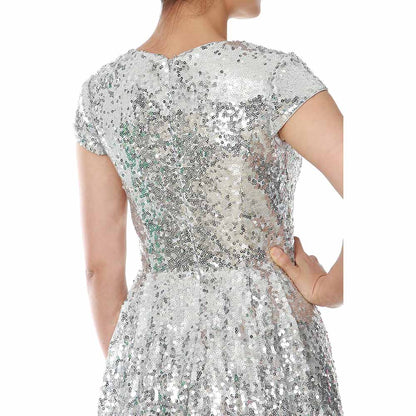Back view of a sequin mother of the bride dress in silver, featuring cap sleeves and elegant shimmer