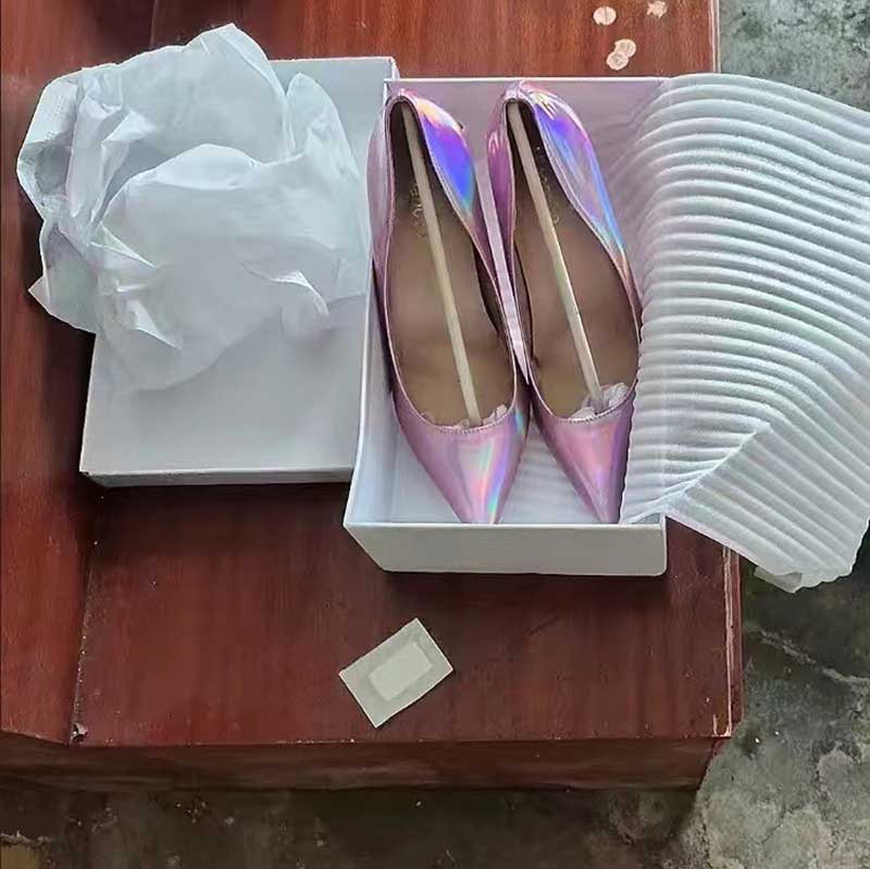 Shiny party heels for women in pink with a stylish design, packaged in a box with tissue paper