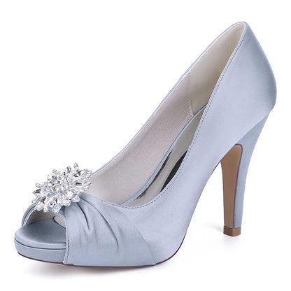 Elegant satin peep toe wedding shoes in light blue with a decorative jeweled flower accent