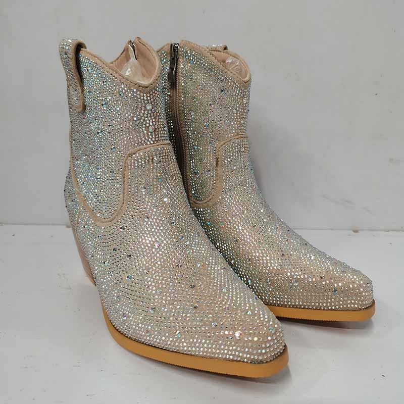 Sparkly cowboy boots covered in glittering rhinestones for stylish country wear