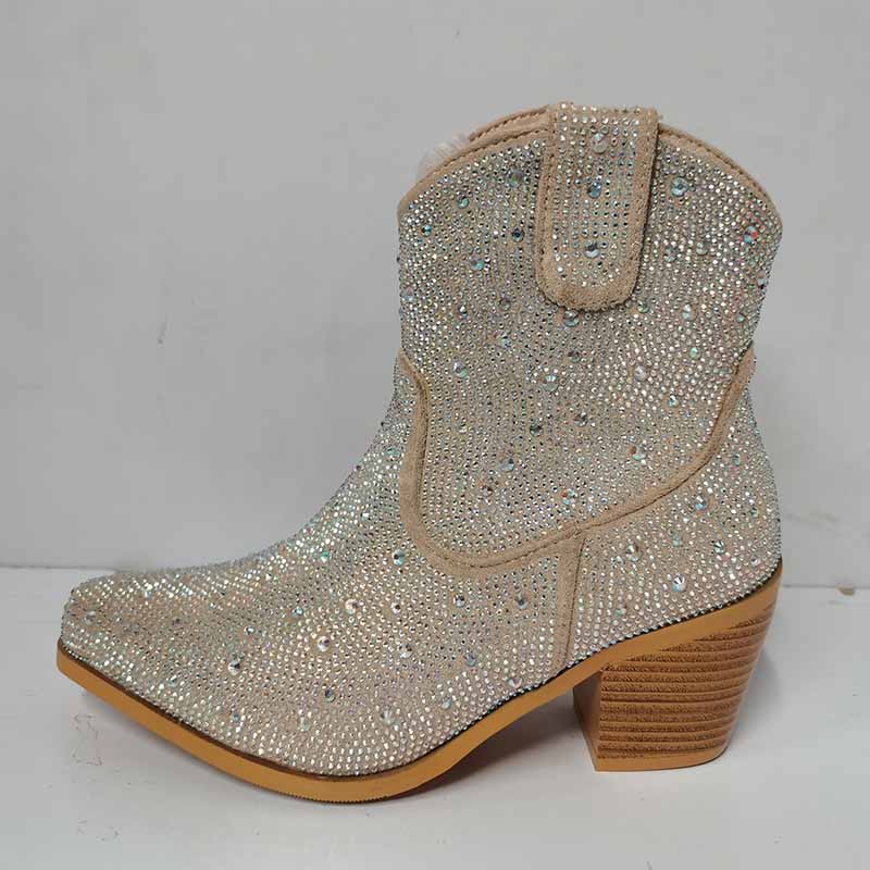 Sparkly cowboy boots with rhinestone detailing and a stylish heel for a trendy western look