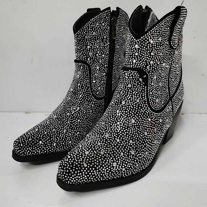 Sparkly cowboy boots featuring rhinestone embellishments and a sleek design for a glamorous western look