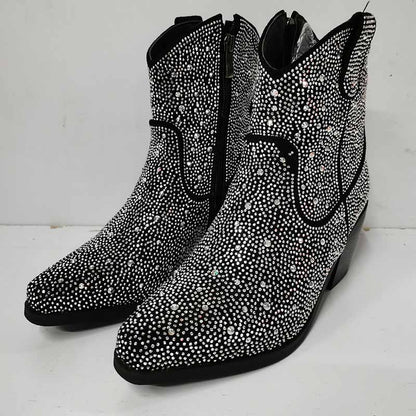 Sparkly cowboy boots featuring rhinestone embellishments and a sleek design for a glamorous western look