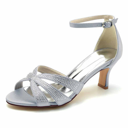 Silver S&DCo. sparkly heels for parties with ankle strap and glittery details