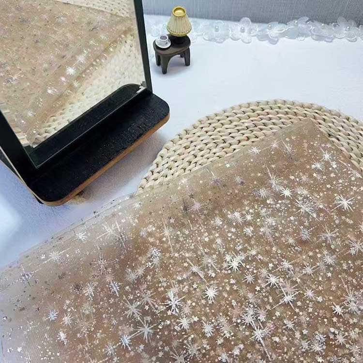 Sparkly hooded robe for wedding displayed on a table with a mirror and decorative items