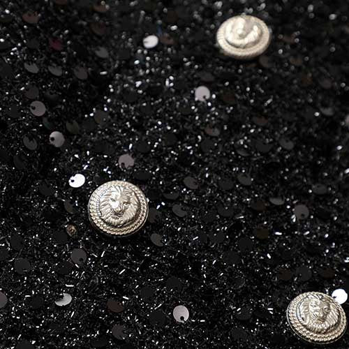 Sparkly party blazer for women featuring sequins and decorative silver buttons for a glamorous look