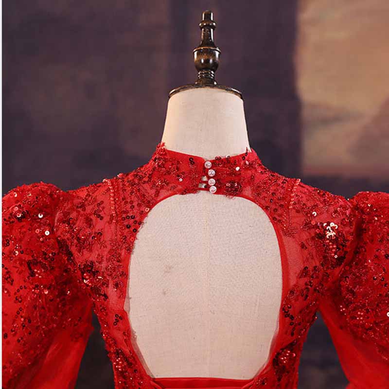 Sparkly red ball gown wedding dress with embellished details and elegant back design