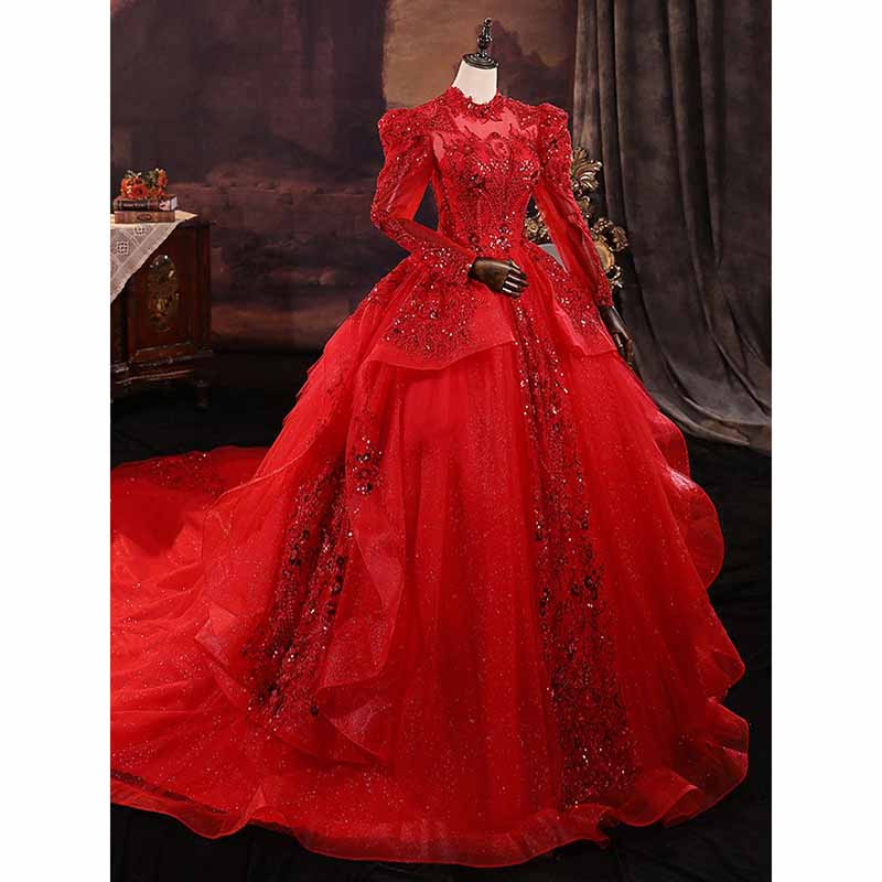 Sparkly red ball gown wedding dress with intricate detailing and dramatic sleeves for a stunning bridal look