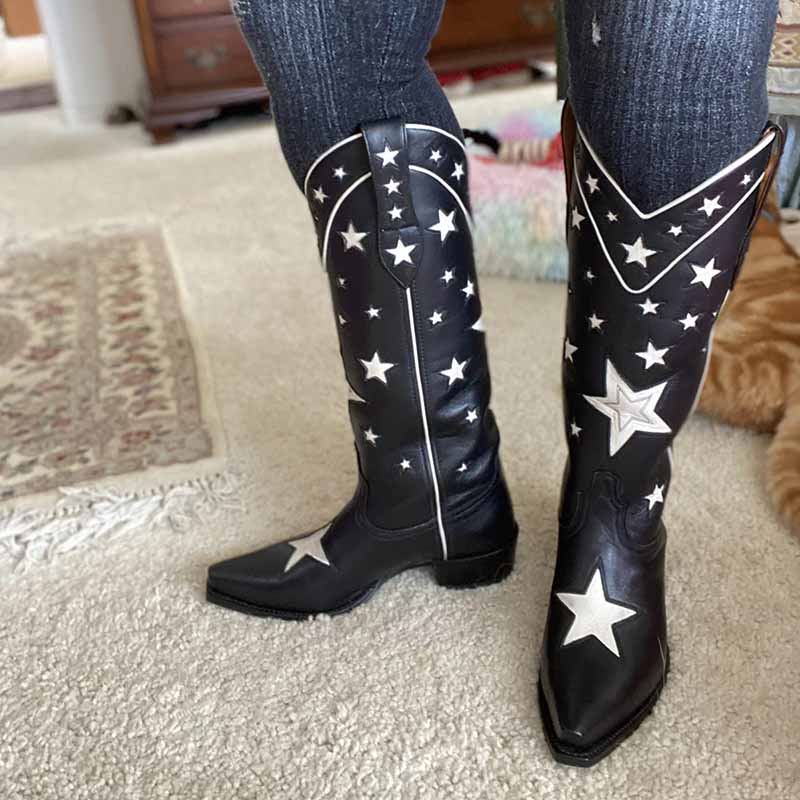 Stylish star embroidered cowboy boots in black with white star designs and decorative stitching