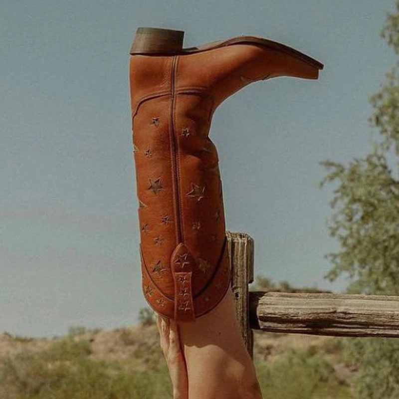 Star embroidered cowboy boots in rich brown leather with detailed stitching and a stylish design