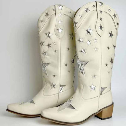 White star embroidered cowboy boots with silver star detailing and classic pointed toe design