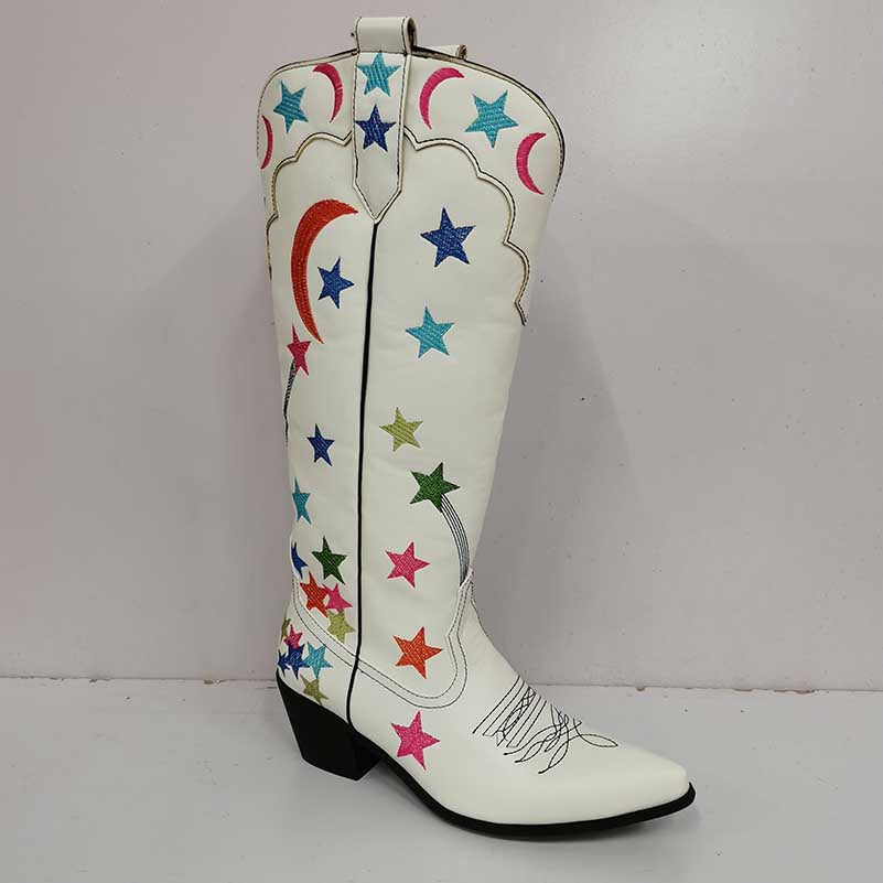 Star pattern knee high cowgirl boots in white with colorful star and moon designs for a trendy western look