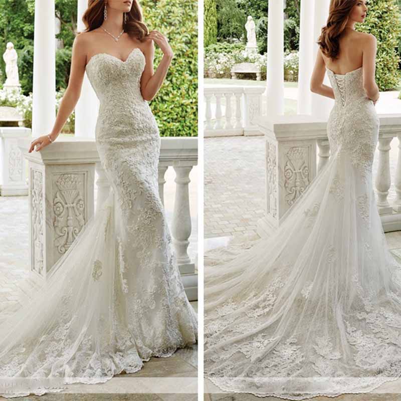 Elegant strapless lace mermaid wedding dress with a sweetheart neckline and a flowing train