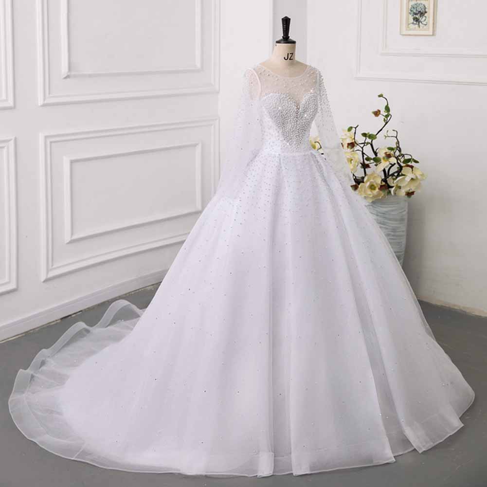 Elegant sweetheart tulle wedding dress with sheer long sleeves and sparkling embellishments