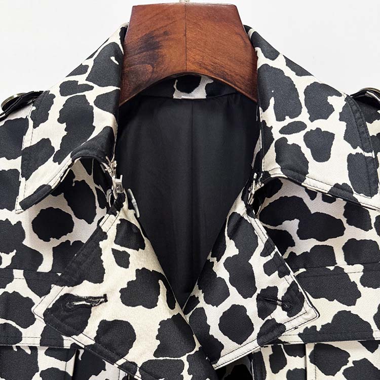 Stylish tailored animal print long coat with a chic black and white cow pattern