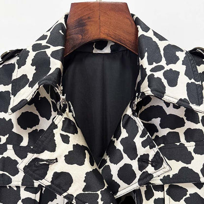 Stylish tailored animal print long coat with a chic black and white cow pattern