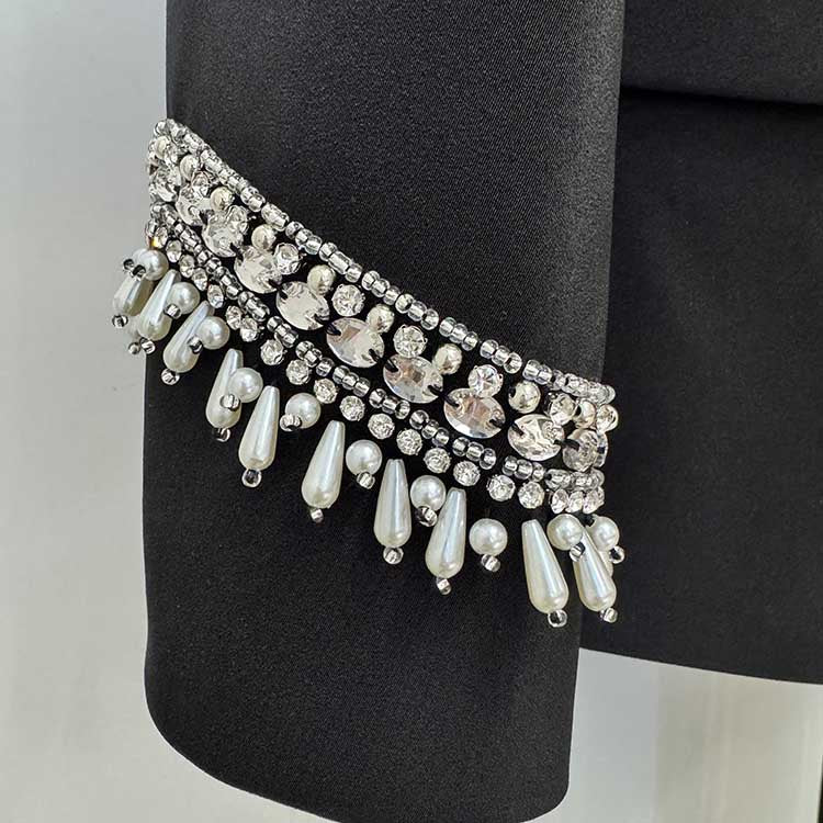 Close-up of embellishments on tailored wide leg trousers suit for women by SD Dresscode & Fashiontrends