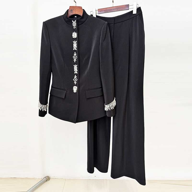 Elegant tailored wide leg trousers suit for women in black with detailed embellishments on the jacket