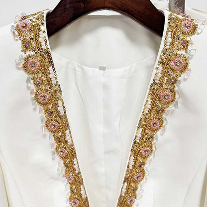 Elegant tailored women's trouser suit for special occasions featuring intricate beaded detailing on the neckline