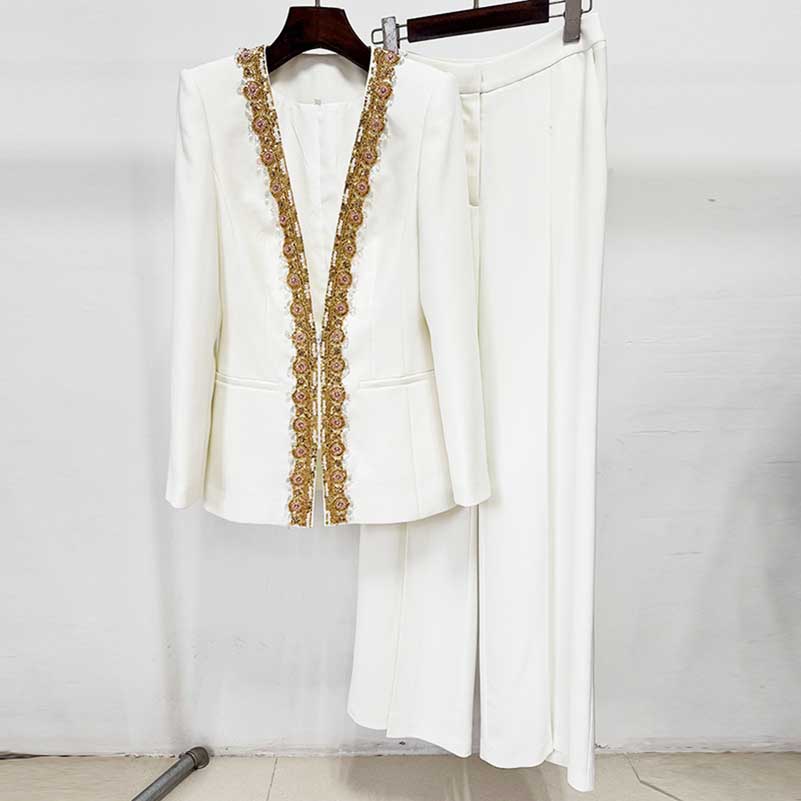Elegant white tailored women's trouser suit for special occasions by SD Dresscode & Fashiontrends with intricate embroidery