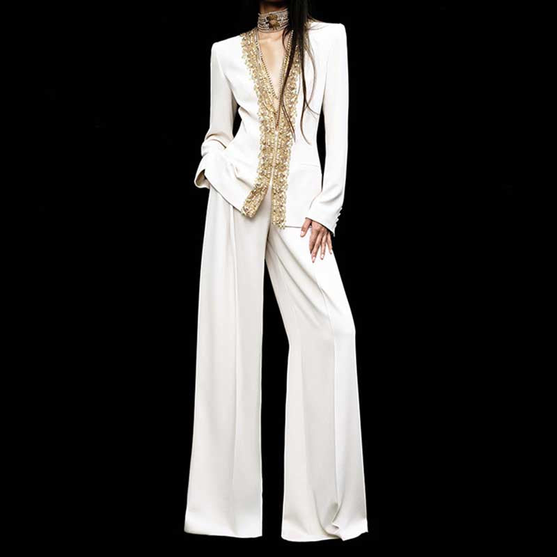 Elegant tailored women's trouser suit for special occasions featuring a embellished blazer and wide-leg pants