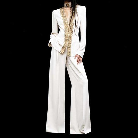 Elegant tailored women's trouser suit for special occasions featuring a embellished blazer and wide-leg pants