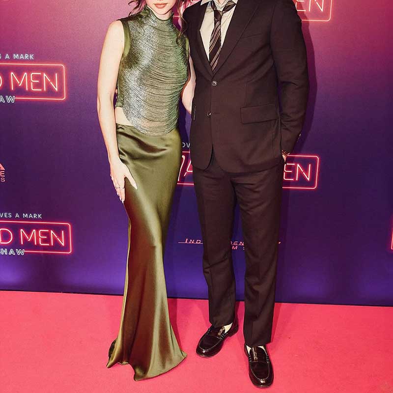 Elegant tassel turtleneck satin two-piece set showcased on a model at a red carpet event