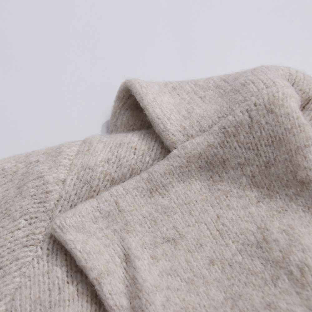 Close-up of a soft beige fabric showcasing a three piece women's sweater set from SD Dresscode & Fashiontrends
