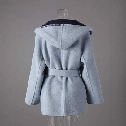 Two-sided winter coat women in light blue with a hood and belted waist for stylish warmth