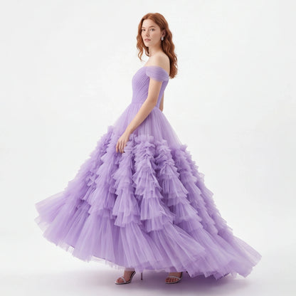 Woman wearing a purple gown on a white background