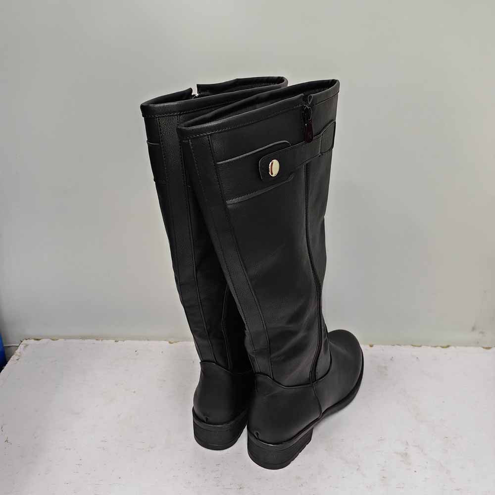 Back view of unisex faux leather riding boots with a sleek design and decorative button detail