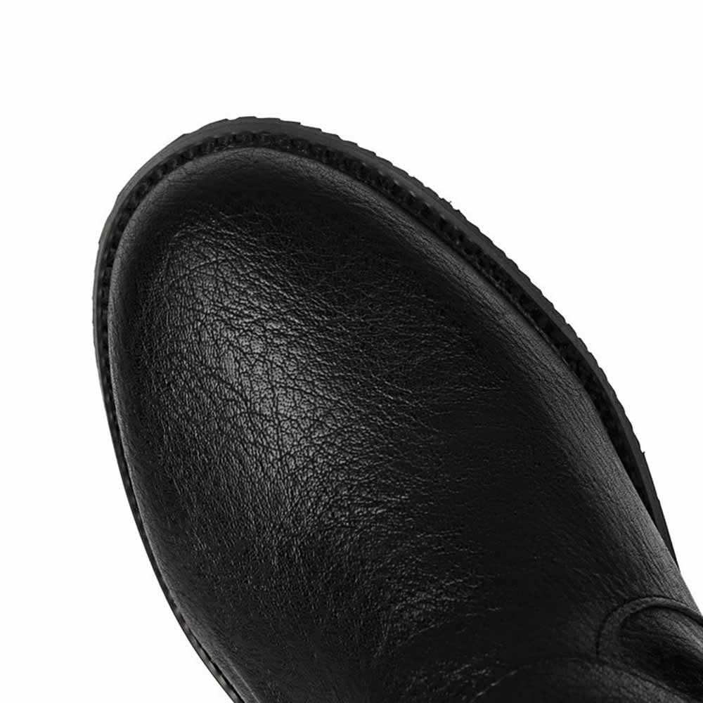 Close-up of sd-hk unisex flat high top boots in black leather with textured finish