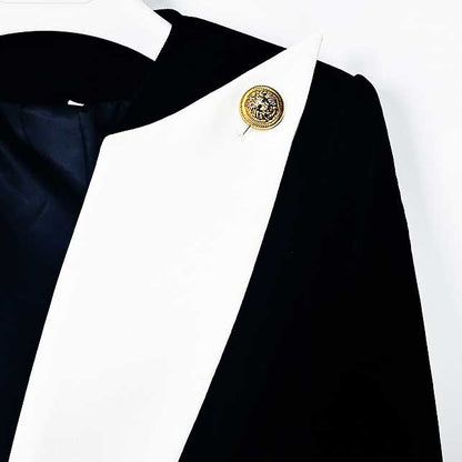 Stylish velvet black blazer with a unique white lapel and decorative pin detail