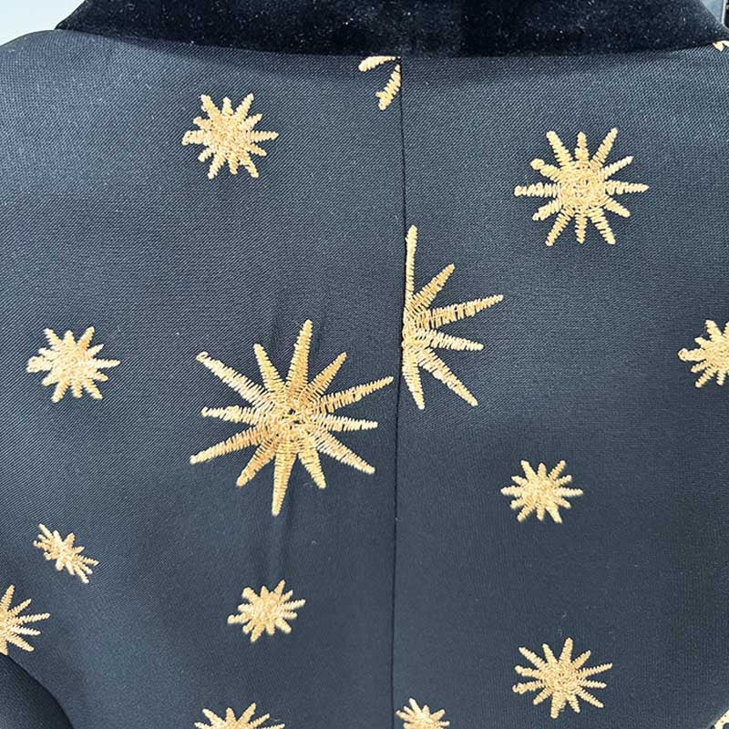 Back view of a stylish velvet feather trim 2-piece suit for women with gold star embellishments