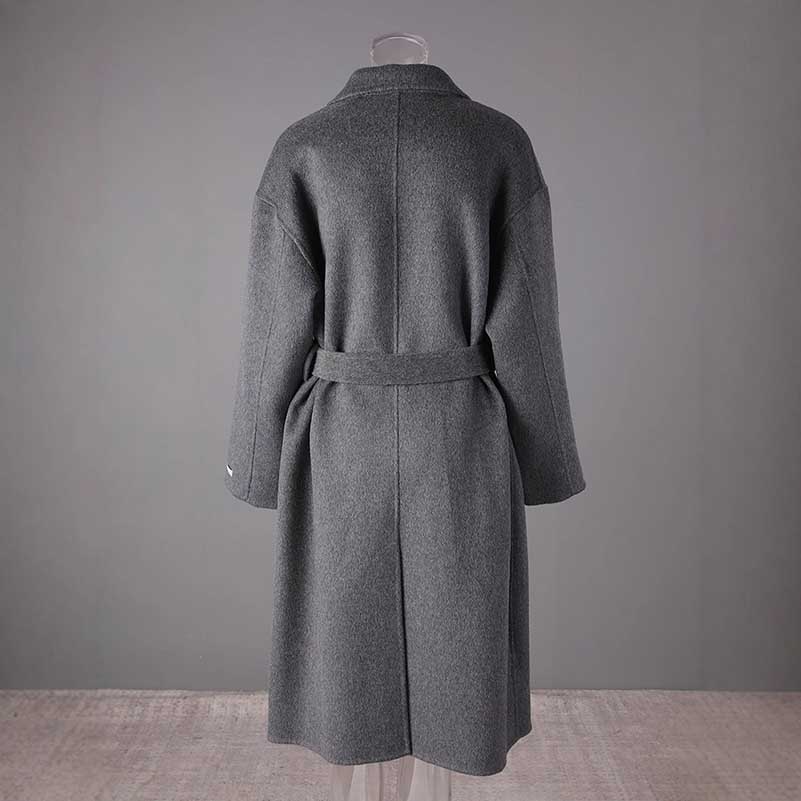 Women's double-breasted grey coat with a relaxed fit and belt for elegant layering