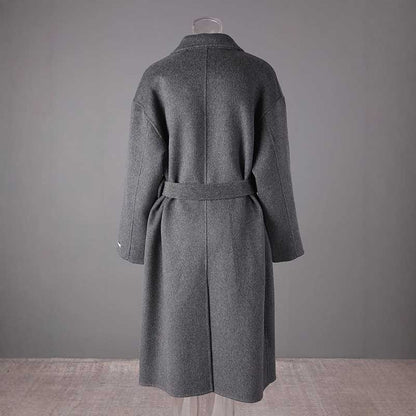 Women's double-breasted grey coat with a relaxed fit and belt for elegant layering