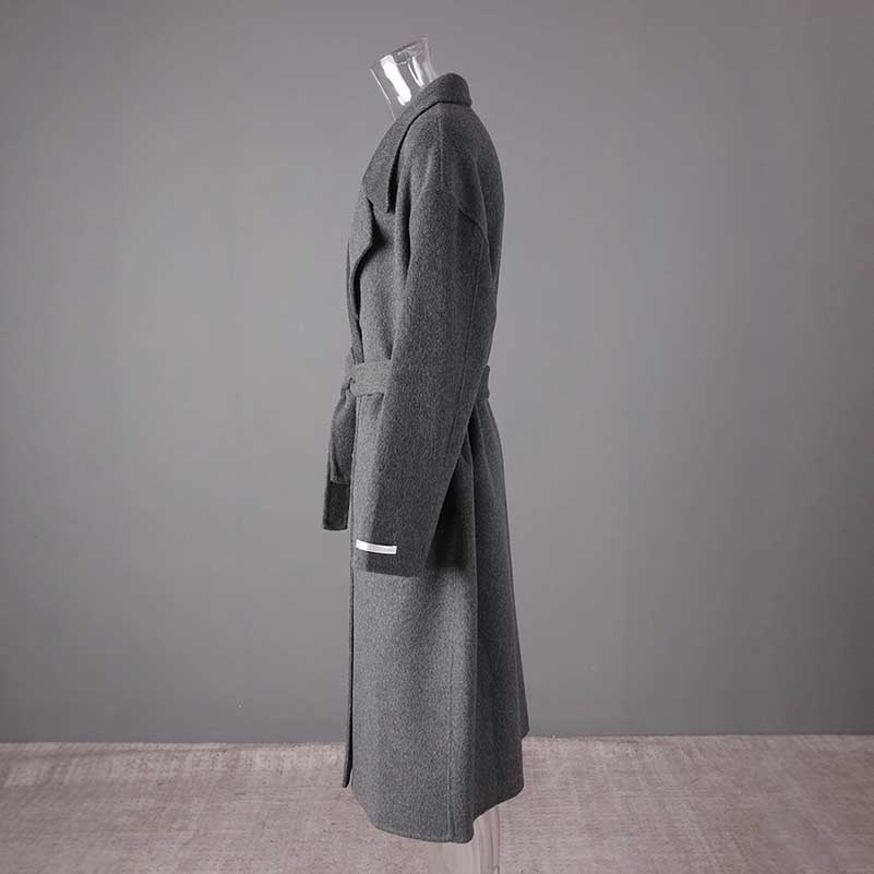 Women's double-breasted grey coat with a stylish belt and elegant design