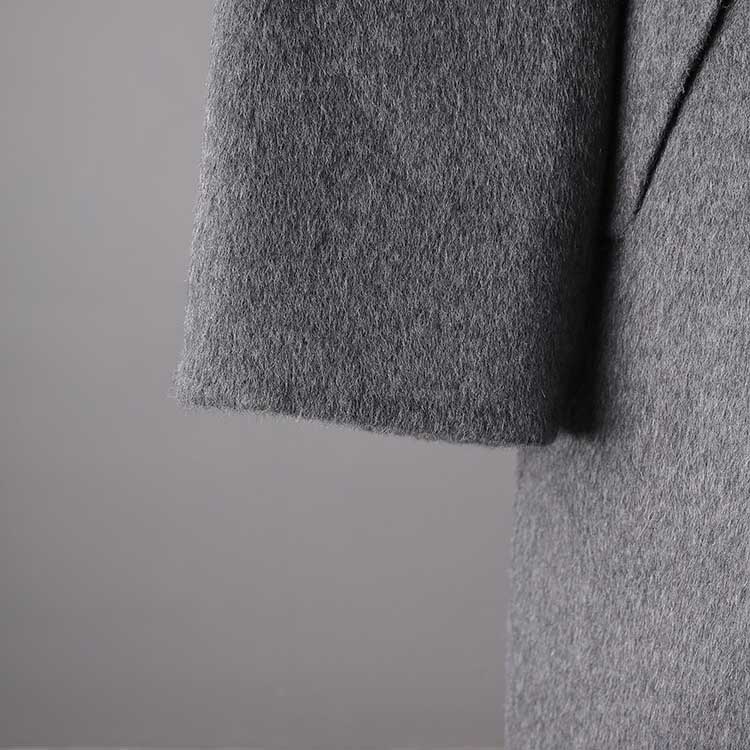 Stylish women's double-breasted grey coat made from soft fabric for a warm and chic look