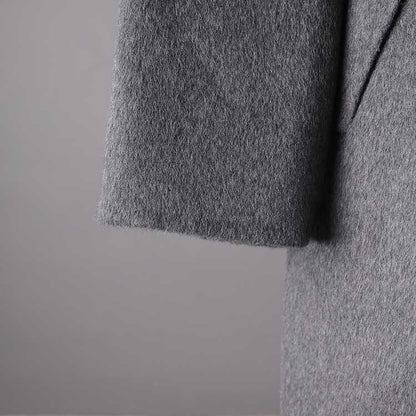 Stylish women's double-breasted grey coat made from soft fabric for a warm and chic look