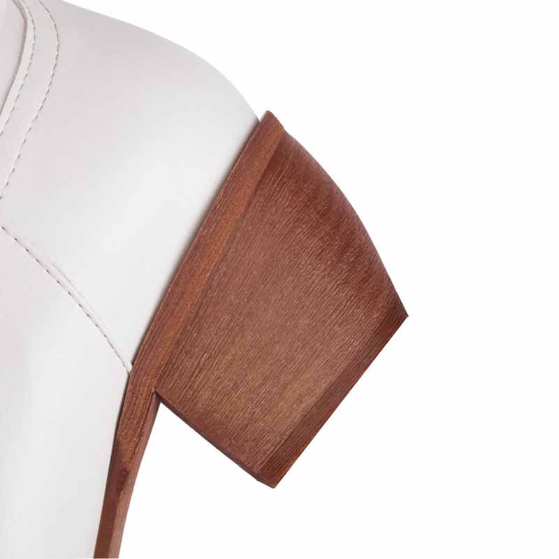 Close-up of vintage floral western booties women showcasing a stylish wooden heel design