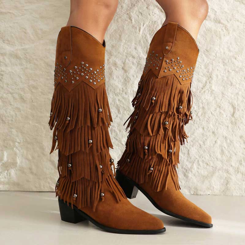 Vintage tassel cowgirl boots in brown with fringe and decorative studs for stylish Western flair