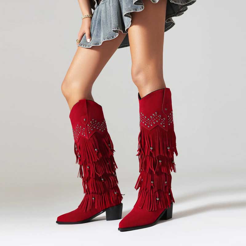 Red vintage tassel cowgirl boots with fringe detailing and decorative studs for a bold western look